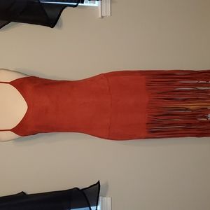 Adorable dress more like a rust color. Side zipper closure